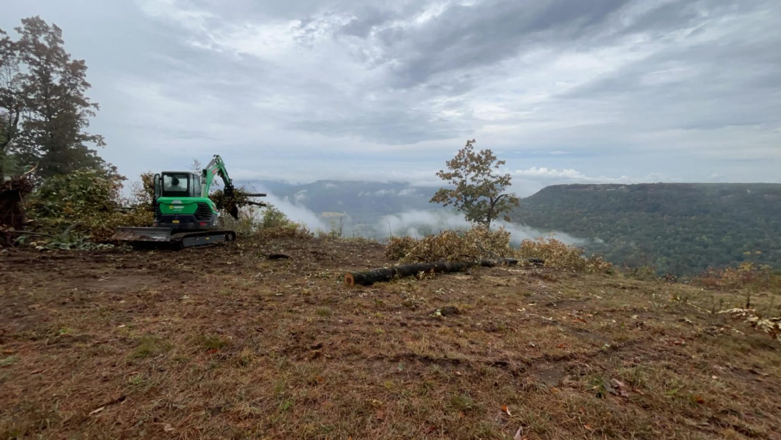 Liberty excavator clearing a ridge-top lot